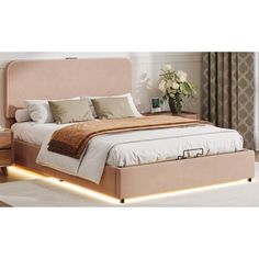 a bed with a light up headboard and foot board