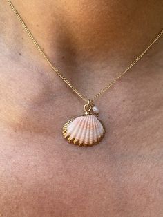 Indulge in the gorgeous beauty of this handmade 16" Small Scallop Shell Necklace, adorned with a tiny pearl and delicate 14kt gold filled chain. Make a statement with this elegant piece and elevate your style today! Affordable Pearl Shell Necklace Gift, Stuff To Do With Seashells, Dainty Shell-shaped Necklace With Pearl Charm, Shell-shaped Pearl Charm Necklace, Pearl Charm Shell-shaped Jewelry, Shell-shaped Necklace With Adjustable Chain, Shell-shaped Pearl Charm Jewelry, Dainty Handmade Shell-shaped Jewelry, Handmade Dainty Shell-shaped Jewelry