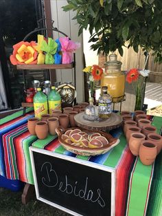 a table topped with pots and plates filled with food next to a sign that says salads