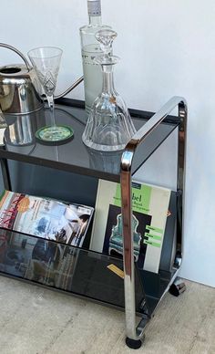 there is a glass table with magazines on it