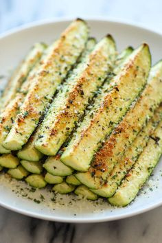 grilled zucchini on a plate with seasoning