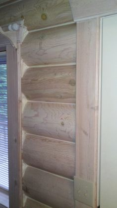 the inside of a house with wood paneling