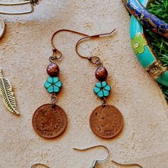 Antique Handmade Turquoise Flower Indian Head Penny French Hook Earrings Beautiful Turquoise Flower Accent & Copper Colored Bead Red Copper Color French Hooks & Hardware Hypoallergenic Lead & Nickel Free French Hooks Are Recommended For Sensitive Ears Unique, One Of A Kind Earrings A 1899 & 1907 Circulated Indian Head Penny Are Used For This Pair The Coins Are Over 120yrs Old For There Age & Being In Circulation And We're Used As Currency On A Daily Basis, They Are In Great Condition The Indian Brown Bohemian Drop Flower Earrings, Bohemian Brown Dangle Flower Earrings, Handmade Brown Bohemian Flower Earrings, Pink Halo, Nickel And Suede, Enamel Stud Earrings, French Hook Earrings, Turquoise Drop Earrings, Stone Dangle Earrings