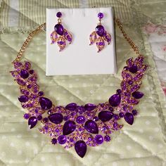 . Never Worn. Necklace Is 10 In Long. Earrings Are 1 7/8 In Long. Purple Crystal With Gold Plating. Post Earrings.Sold As Set. Purple Costume Jewelry For Party, White Sapphire Wedding Set, Sapphire Wedding Set, Bohemian Beaded Bracelet, Gold Costume Jewelry, Best Friend Bracelets, Rhinestone Jewelry Set, Gold Costume, Formal Jewelry