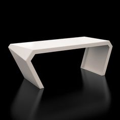 a white bench sitting on top of a black floor