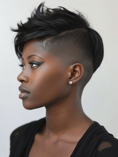 Lastly, for the woman who straddles the line between casual and trendy, the very short relaxed pixie haircut black women is a breath of fresh air. This style is relaxed in texture but bold in cut, with a tousled top that’s effortlessly stylish. It’s a go-to for the trendsetter who’s as confident stepping into a boardroom as she is lounging at a café. Short Black Hairstyles Pixies, Red Pixie Haircut, Tapered Haircut For Women, Graduated Haircut, Short Shaved Hairstyles