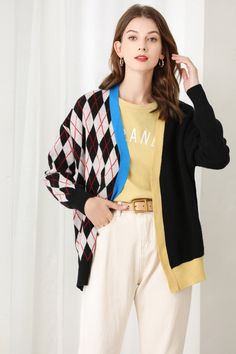 Fabric: 32.8% Wool 35.3% Polyester 31.9% Nylon Color: Black, White, Blue Care: Hand wash or dry clean This oversized cardigan is argyle detail and splicing stitch. This oversized cardigan is a great layering piece. The V neckline and rib cuff and bottom make it easy to wear over any outfit. Long sleeves. Contrast colors. Front button closure. Model is 175cm/5'9" tall. Winter Color Block Cardigan For Layering, Winter Color Block Layering Cardigan, Black Sweater With Contrast Color For Spring, Winter Cardigan With Contrast Color For Layering, Trendy Black Color Block Cardigan, Long Sleeve Cardigan With Contrast Color For Layering, Long Sleeve Cardigan For Layering With Contrast Color, Black Long Sleeve Color Block Cardigan, Black Color Block Long Sleeve Cardigan