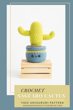 crochet saguaro cactus stuffed animal sitting on top of a wooden block