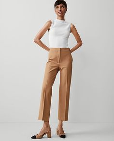 Elevate your wardrobe with the Ann Taylor Button Pencil Pant in Twill, a testament to sophistication and comfort. Perfectly tailored to flatter, these pants are a versatile addition to any fashion-forward woman's collection.

- **Size**: 18 Regular
- **Color**: Perfect Camel
- **Material**: 54% Viscose, 39% Cotton, 7% Lyocell
- **Gender**: Female
- **Fit**: Tailored and fitted
- **Rise**: High rise; sits 1/2" to 1" below natural waist
- **Length**: Hits at ankle; 28" inseam with 17 1/2" leg open Women’s Work Pants, Camel Pants Outfit, Pants For Petite Women, Taupe Pants, Camel Pants, Pencil Pant, Sequin Pencil Skirt, Work Pants Women, Blazer And Skirt