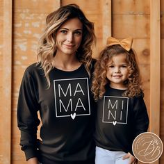 MAMA and MINI  Sweatshirt Fall-Inspired Matching Fall Sweatshirts Mama and Mini Matching Sweatshirts Mommy and Me Sweatshirts Matching Sweatshirts for Fall Embrace the charm of autumn with our trending Matching Mama & Mini Sweatshirts, a must-have for this fall season. The minimalist design makes them the perfect outfit for your picture-perfect moments. Make memories, stay stylish, and warm your hearts with these adorable matching sweatshirts. Fall in love with the season, fall in love with twin Mother's Day Black Crew Neck Sweatshirt, Long Sleeve Tops With Letter Print For Mother's Day, Black Crew Neck Tops For Mother's Day, Black Long Sleeve T-shirt For Family Matching, Family Matching Long Sleeve Letter Print Tops, Fall Family Matching Crew Neck Tops, Family Matching Black Tops For Fall, Black Family Matching Tops For Fall, Long Sleeve Tops With Letter Print