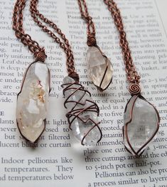 A selection of 4 totally magical and uniquely wrapped raw quartz crystal necklaces. Each wrapped in solid antiqued copper wire and strung on matching chain in your choice of length! Necklace A- Flat Clear Quartz Crystal Necklace B- Quartz with red iron inclusions and some cool crystal growth on one face!  Necklace C- Tangerine Quartz from Nova Scotia, has some peachy undertones Necklace D- Chunkier Clear Quartz Crystal Crystal Necklace Copper, Unique Wire Wrapped Copper Crystal Necklaces, Unique Copper Wire Wrapped Crystal Necklaces, Electroformed Crystal Necklace With Copper Wire, Crystal Necklace Aesthetic, Crystal Wire Wrapping, Crystal Necklace Diy, Crystal Jewelry Ideas, Jewelry Modeling