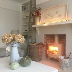 a living room filled with furniture and a fire place