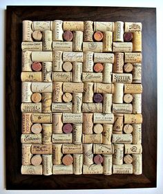 a framed cork art piece with wine corks on it