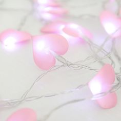 pink and white lights are strung up on the floor