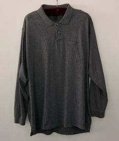 This men's Van Heusen polo shirt is a nice gray color, collared and is long sleeved. !00% cotton so very soft. There is a chest pocket and has ribbed cuffs! Easy care as it is machine washable. Looks great with shorts, pants or jeans! Measurements are: arm pit to arm pit 25 inches, sleeve length 24.5 inches, shoulder seam to shoulder seam 22 inches and under back collar to hem 33 inches. Please check out photos to see how great this shirt is!  Please visit my eBay store, thriftylady1990, often s Long Sleeve Cotton Polo Shirt With Pockets, Cotton Long Sleeve Polo Shirt With Pockets, Solid Long Sleeve Cotton Polo Shirt, Relaxed Fit Long Sleeve Cotton Polo Shirt, Gray Long Sleeve, Shorts Pants, Van Heusen, Grey Pattern, Mens Vans