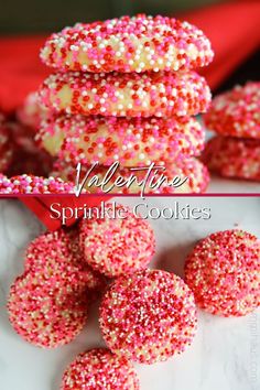 valentine's day sprinkle cookies stacked on top of each other