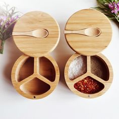 three wooden containers with spoons and spices in them