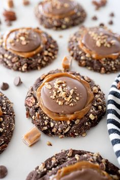 chocolate covered cookies with peanut butter on top