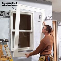 a man working on a window in the process of being installed