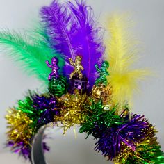 Mardi Gras is here! These iconic king cake babies sit on top of disco balls in all the traditional Mardi Gras colors. This headpiece will be the icing on the King Cake to top off your Mardi Gras outfits for all the festivities. *Locally hand made in New Orleans. Headpieces usually ship within 3-5 business days. Please be aware that due to the unique and handmade nature of each product, color, shapes, and sizes may vary slightly from the photo and descriptions. Mardi Gras Headpiece, Mardi Gras Throws, Mardi Gras Dress, Mardi Gras Colors, King Cake Baby, Mardi Gras Crafts, Mardi Gras Outfits, Mardi Gras Costumes, Mardi Gras Decorations