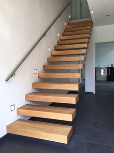 a set of wooden stairs leading up to the second floor