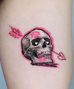 a skull with an arrow on the side of its head is shown in pink ink