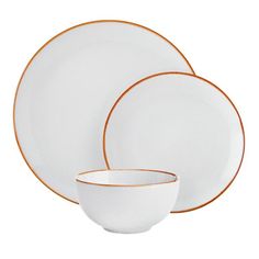 white and orange dinnerware with gold rims