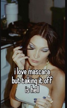 a woman holding a tablet with the caption i love mascara but taking it off is hell