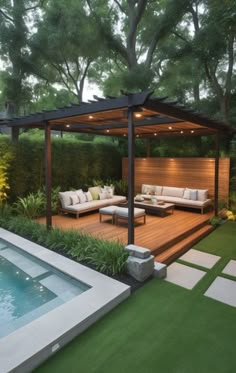 an outdoor living area with couches, tables and a pool in the back yard