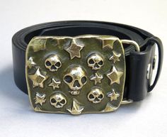 "Recently created in my new artist-blacksmithing studio near Berkeley Springs, WV! Here's one that will stand out and make a statement! Skulls and stars will even keep the Zombies away! So, what are your likes and desires? This buckle will make a statement for and about you. Also great as a side buckle! This hot forged solid bronze belt buckle was made from a bar of bronze that was hammered and squished using hand hammer and anvil and a home made 60 ton hydraulic forging press. I made of all of Berkeley Springs Wv, Skull Belt Buckle, The Zombies, Couple Fits, Anvils, Handmade Stamps, String Bag, New Rock, Cool Fits