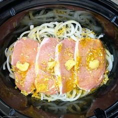 three pieces of meat and noodles in a slow cooker