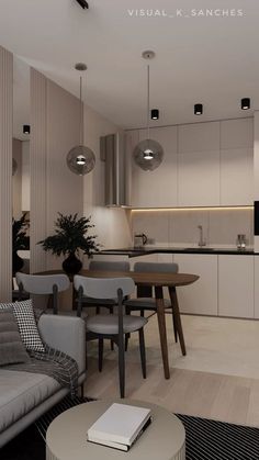 a living room filled with furniture next to a kitchen