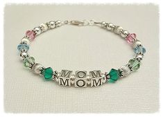 "Personalized Beaded Mothers or Grandmothers Bracelet Personalize your bracelet with any NAMES (or Mom, Grandma, etc) on a single or multi strand bracelet. Shown in picture with 1 Name on 1 Stand with your choice of Swarovski Crystal Birthstone beads Handmade using all .925 Sterling Silver beads (letter blocks, Bali beads, spacer beads, clasp, etc.) Please choose your bracelet length above ~ Average woman's size is 7.5\" long Your choice of a Lobster Clasp or Toggle Clasp In the box above, pleas Beaded Name Bracelet, Birthstone Crystals, Birthstone Colors, Multi Strand Bracelet, Name Bracelet, Strand Bracelet, Block Lettering, Silver Bead, Sterling Silver Bead