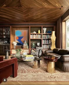 a living room filled with furniture and bookshelves