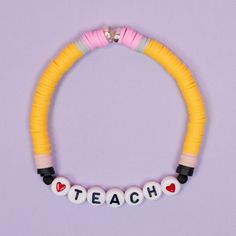 Easy DIY Teacher Bracelets that look like pencils and notebooks! Make this fun clay bead bracelet set for your favorite teacher! Teacher Clay Bracelet Ideas, Clay Bead Diy, Teacher Clay Bead Bracelet Ideas, Clay Bead Bracelet Ideas School, Bracelet Ideas For Teachers, Clay Bead Bracelet Ideas For Women, Play Bracelet Ideas, Cute Clay Bead Bracelet Ideas For Mom, School Clay Bead Bracelet