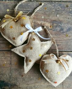 two small bags with stars on them sitting on a wooden table next to each other