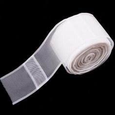 a roll of white fabric on a black background with the words enjoienan