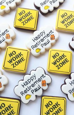 there are many cookies that say happy retirement paul and no work zone on the table