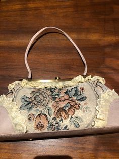 Vintage brocade lace patchwork hand bag purse Vintage styled bag Nice brocade florals with golden threads 6 in x 13 in 18 in wrist strap All shipped free in the US Please check out our THOUSANDS of great reviews Vintage Beige Tapestry Bag, Retro Rectangular Fabric Bag, Vintage Tapestry Pouch Bag, Vintage Tapestry Shoulder Bag With Removable Pouch, Vintage Cream Handheld Bag, Formal Embroidered Tapestry Bag, Formal Tapestry Bags, Victorian Style Embroidered Rectangular Bag, Vintage Tapestry Bag With Detachable Handle