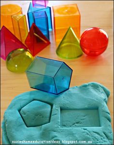 there are many different colored shapes on the table