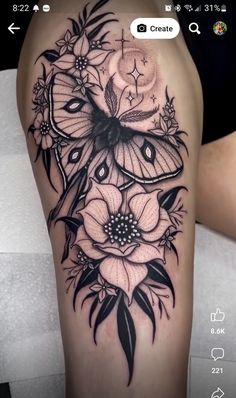 a woman's thigh with flowers and butterflies on the thighs, in black and white