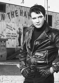 black and white photograph of man in leather jacket