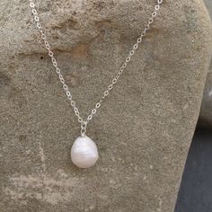 This simple, delicate necklace combines a Baroque fresh water pearl and fine silver cable chain. At 18” long, it is an everyday necklace that you can wear all year long and perfect for layering. It makes a great gift! Dainty White Charm Necklace With Cable Chain, Dainty Silver Baroque Pearl Necklace, Minimalist Silver Necklace With Baroque Pearl, Minimalist Silver Baroque Pearl Necklace, Dainty Silver Baroque Pearl Necklaces, Everyday Sterling Silver Pearl Necklace, Pearl Cable Chain Necklaces As Gift, White Sterling Silver Necklace With Pearl Drop, White Sterling Silver Drop Necklace With Pearl Pendant