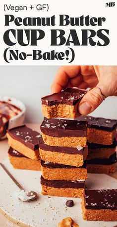 a stack of peanut butter cup bars with chocolate frosting