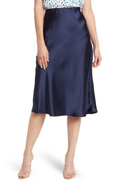 Elevate your wardrobe with this pull-on bias satin midi skirt for elegant, feminine style. 31" length (size S) Elasticized waist Pull-on style Satin construction 97% polyester, 3% spandex Machine wash cold, line dry Made in USA Model’s stats for sizing: 5’10” height, 34” bust, 27” waist, 35” hips. Model is wearing size S. Navy Satin Midi Skirt Outfit, Relaxed Midi Skirt With Bias Cut, Satin Relaxed Bias Cut Skirt, Silk Knee-length Skirt For Night Out, Elegant Satin Midi-length Bottoms, Elegant Satin Midi Bottoms, Elegant Satin Midi Length Bottoms, Formal Knee-length Satin Skirt, Formal Satin Knee-length Skirt