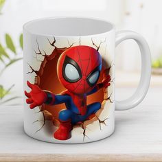 a spider - man coffee mug is shown with the image of himself breaking through it