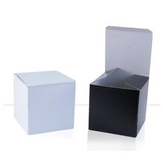 two black and white boxes sitting next to each other