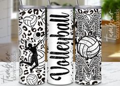 two white tumbles with black and white designs on them, one is holding a volleyball ball