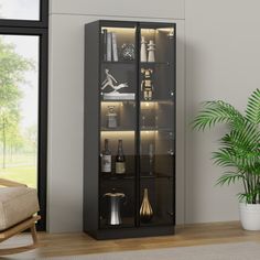 a living room with a glass door cabinet