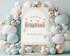 a welcome to babyland sign in front of balloons